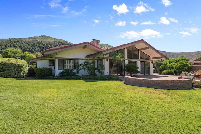 32204 Wiskon Way, Pauma Valley, CA 92061 - rear view of house with a mountain view, a lawn, and a chimney