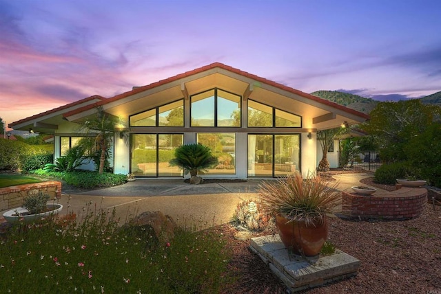 32204 Wiskon Way, Pauma Valley, CA 92061 - back of house at dusk featuring a patio area