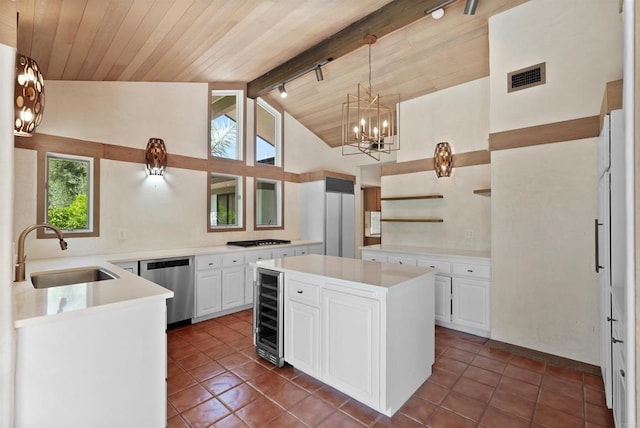 32204 Wiskon Way, Pauma Valley, CA 92061 - kitchen featuring stainless steel appliances, a chandelier, open shelves, dark tile patterned flooring, and wooden ceiling