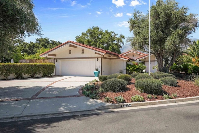 32204 Wiskon Way, Pauma Valley, CA 92061 - mediterranean / spanish house with a tile roof, a garage, and concrete driveway