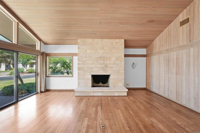 32204 Wiskon Way, Pauma Valley, CA 92061 - unfurnished living room featuring wood ceiling, light wood finished floors, and a stone fireplace