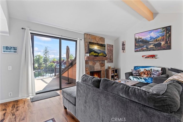 4 Village Unit 2, Lake Arrowhead, CA 92352 - living area with wood finished floors and a stone fireplace
