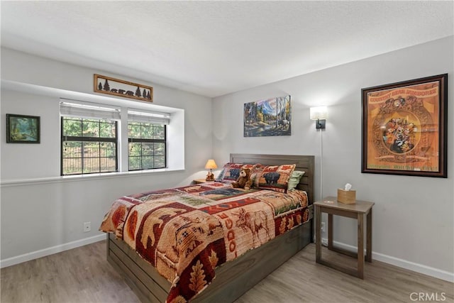 4 Village Unit 2, Lake Arrowhead, CA 92352 - bedroom with wood finished floors and baseboards