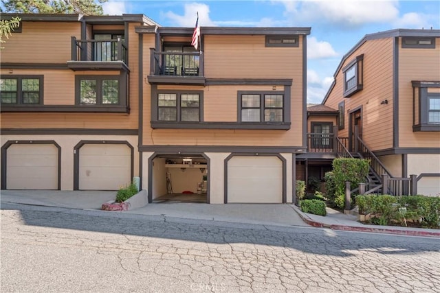 4 Village Unit 2, Lake Arrowhead, CA 92352 - multi unit property featuring an attached garage, driveway, and stairs