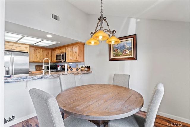 4 Village Unit 2, Lake Arrowhead, CA 92352 - dining area with wood finished floors and baseboards