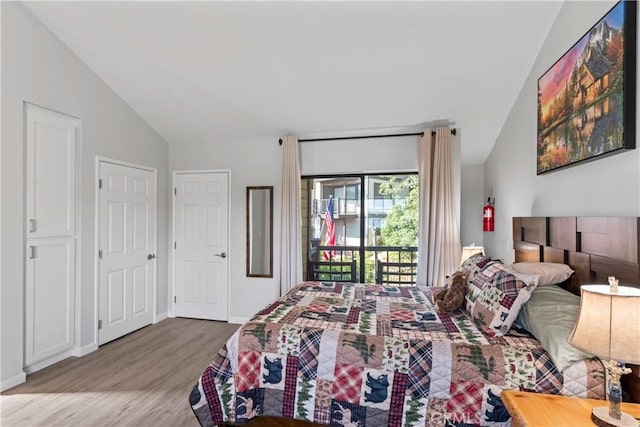 4 Village Unit 2, Lake Arrowhead, CA 92352 - bedroom with lofted ceiling, wood finished floors, and access to exterior