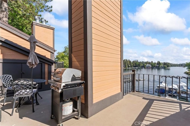 4 Village Unit 2, Lake Arrowhead, CA 92352 - view of patio with a water view, grilling area, and outdoor dining space