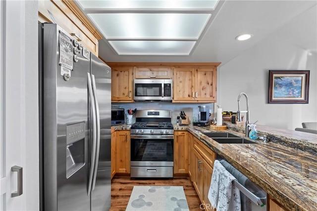 4 Village Unit 2, Lake Arrowhead, CA 92352 - kitchen featuring stainless steel appliances, wood finished floors, dark stone countertops, and recessed lighting