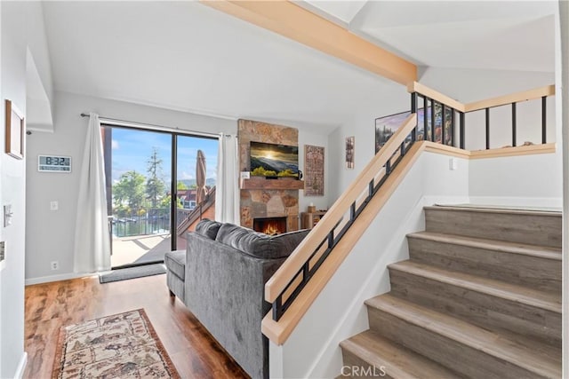 4 Village Unit 2, Lake Arrowhead, CA 92352 - living room with stairs, a fireplace, and wood finished floors