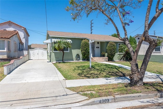 4903 Brayton Ave, Long Beach, CA 90807 - ranch-style house with a gate, driveway, stucco siding, and a front lawn