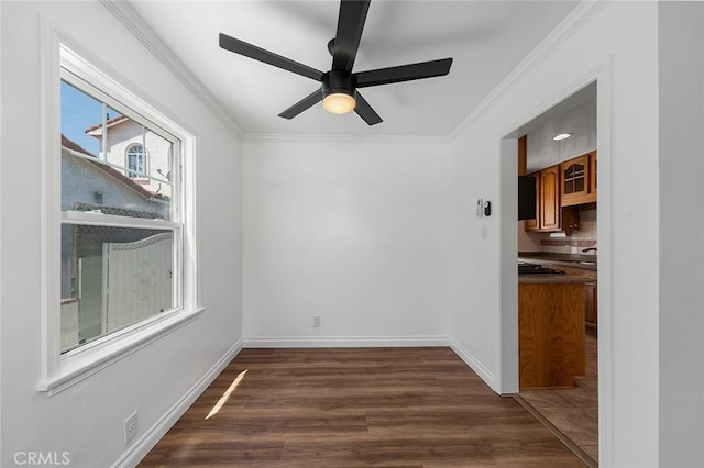 4903 Brayton Ave, Long Beach, CA 90807 - empty room with dark wood-style flooring, ornamental molding, and ceiling fan