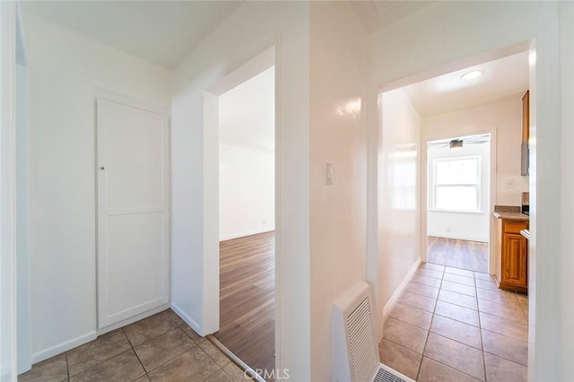 4903 Brayton Ave, Long Beach, CA 90807 - hallway with light tile patterned floors and baseboards