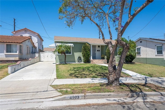 4903 Brayton Ave, Long Beach, CA 90807 - single story home with a gate, concrete driveway, stucco siding, and a front yard