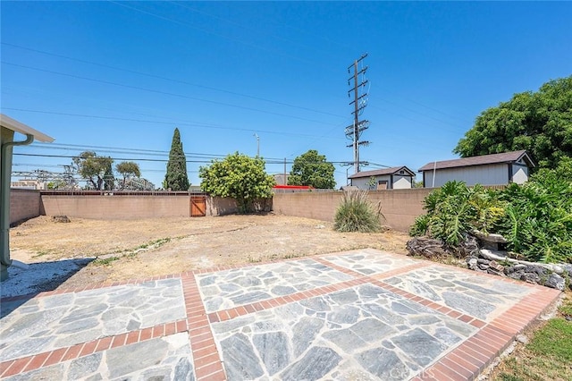 4903 Brayton Ave, Long Beach, CA 90807 - fenced backyard featuring a patio