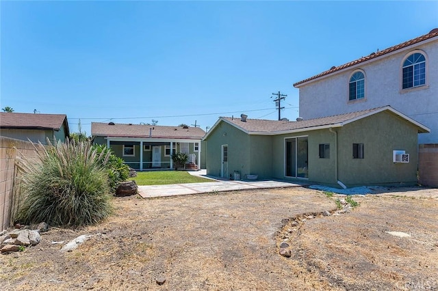 4903 Brayton Ave, Long Beach, CA 90807 - rear view of property with stucco siding and a patio
