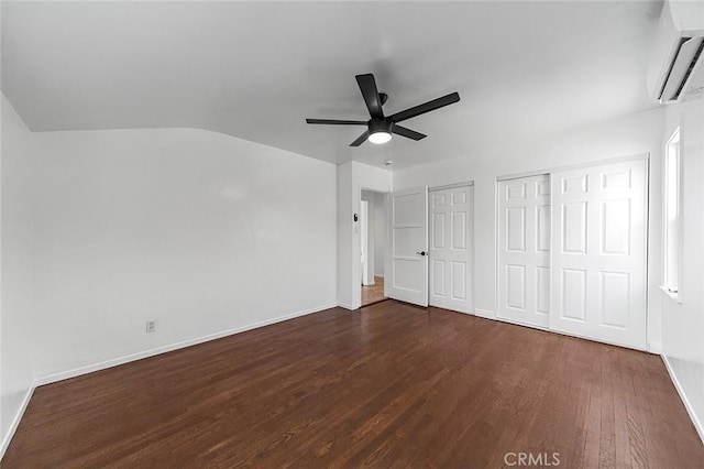 4903 Brayton Ave, Long Beach, CA 90807 - unfurnished bedroom featuring an AC wall unit, dark wood finished floors, ceiling fan, and lofted ceiling