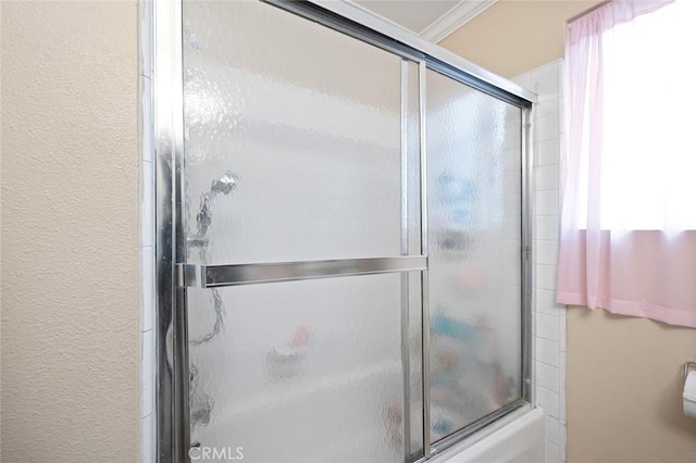 17061 Roscoe Blvd Unit 6, Northridge, CA 91325 - bathroom featuring combined bath / shower with glass door and a textured wall