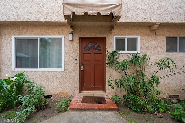 17061 Roscoe Blvd Unit 6, Northridge, CA 91325 - doorway to property with stucco siding