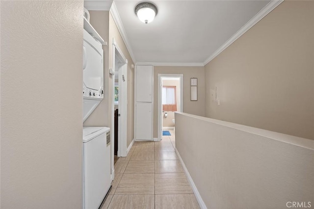 17061 Roscoe Blvd Unit 6, Northridge, CA 91325 - hallway featuring stacked washer / drying machine, crown molding, and light tile patterned floors