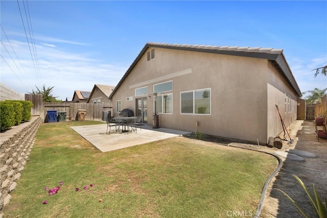 9504 Whitman Ave, Bakersfield, CA 93311 - rear view of house featuring a patio, a fenced backyard, and stucco siding