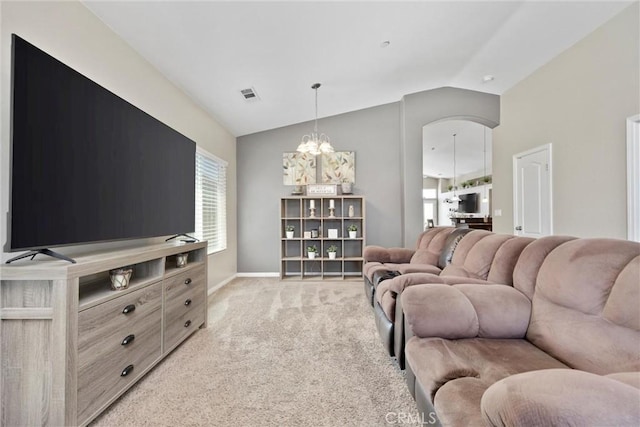 9504 Whitman Ave, Bakersfield, CA 93311 - living area with lofted ceiling, light carpet, and a chandelier