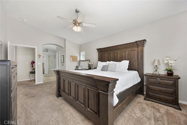 9504 Whitman Ave, Bakersfield, CA 93311 - bedroom featuring arched walkways, light colored carpet, ensuite bath, and ceiling fan