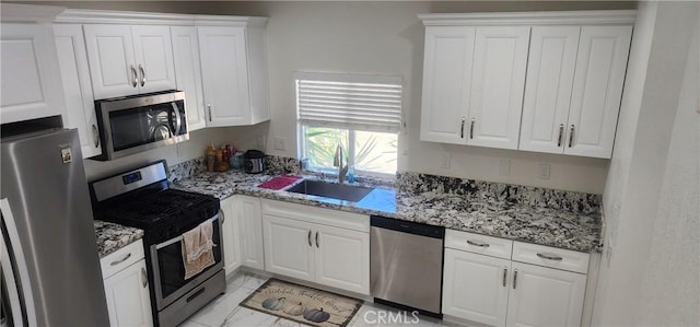 32091 Bayberry Rd, Wildomar, CA 92595 - kitchen featuring stainless steel appliances, white cabinetry, and light stone countertops