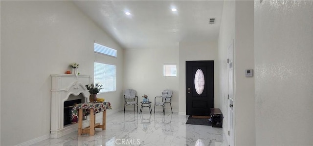 32091 Bayberry Rd, Wildomar, CA 92595 - foyer with light marble finish floors, a fireplace, high vaulted ceiling, and recessed lighting