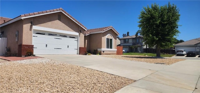 32091 Bayberry Rd, Wildomar, CA 92595 - ranch-style house featuring concrete driveway, stucco siding, a garage, and brick siding