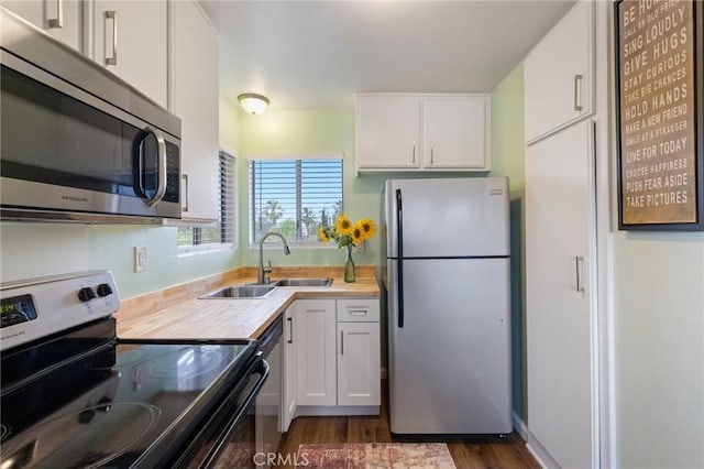 460 Golden Ave Unit 434, Long Beach, CA 90802 - kitchen with appliances with stainless steel finishes, light countertops, white cabinets, and dark wood-style floors