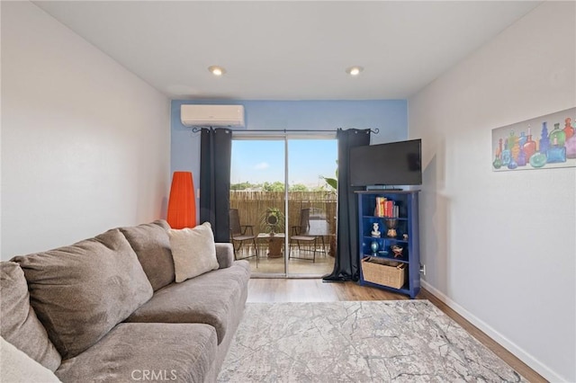 460 Golden Ave Unit 434, Long Beach, CA 90802 - living room featuring light wood finished floors, a wall mounted air conditioner, and recessed lighting