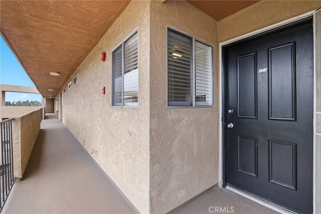 460 Golden Ave Unit 434, Long Beach, CA 90802 - view of exterior entry featuring stucco siding and a balcony