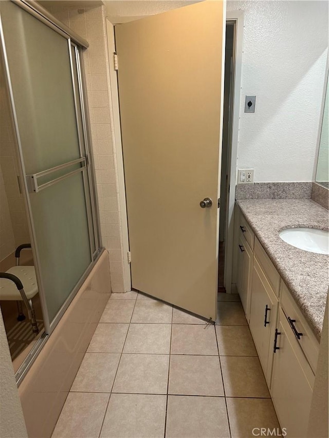 967 Calle Aragon Unit B, Laguna Woods, CA 92637 - bathroom with vanity, tile patterned floors, and combined bath / shower with glass door