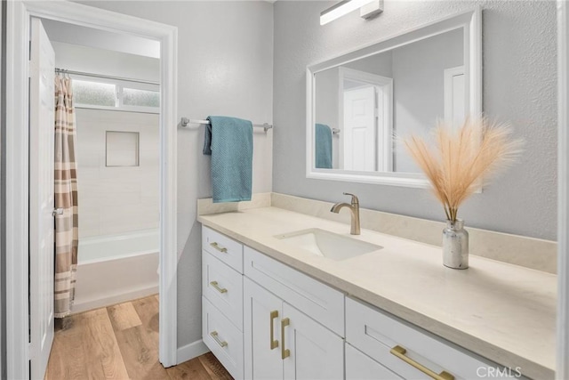626 Arenas St Unit A, La Jolla, CA 92037 - bathroom featuring vanity, wood finished floors, and shower / bath combo with shower curtain