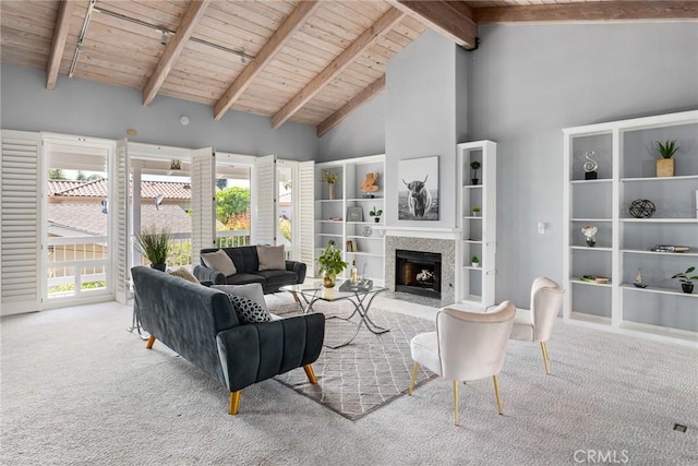 626 Arenas St Unit A, La Jolla, CA 92037 - living area with a wooden ceiling with exposed beams, high vaulted ceiling, carpet flooring, and a fireplace with flush hearth
