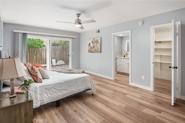 626 Arenas St Unit A, La Jolla, CA 92037 - bedroom featuring light wood-type flooring, a spacious closet, ensuite bath, access to outside, and a ceiling fan