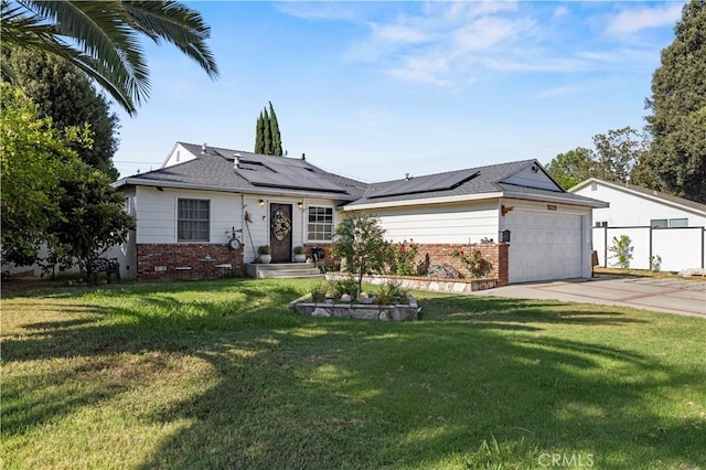 18229 Strathern St, Reseda, CA 91335 - view of front of property with brick siding, an attached garage, concrete driveway, solar panels, and a front lawn