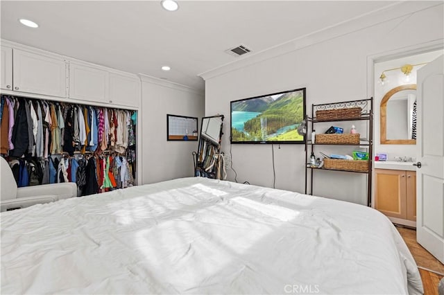 18229 Strathern St, Reseda, CA 91335 - bedroom featuring a closet, light wood finished floors, recessed lighting, and ornamental molding
