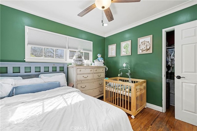 18229 Strathern St, Reseda, CA 91335 - bedroom featuring wood finished floors, crown molding, a ceiling fan, and a closet