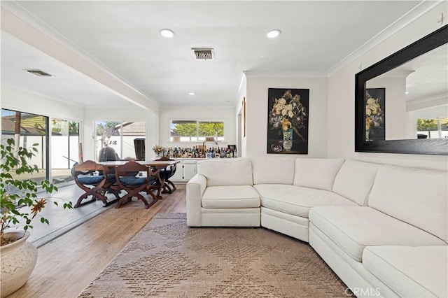 18229 Strathern St, Reseda, CA 91335 - living area featuring wood finished floors, ornamental molding, and recessed lighting