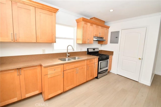 1062 252nd St, Harbor City, CA 90710 - kitchen with gas stove, under cabinet range hood, crown molding, light brown cabinets, and electric panel