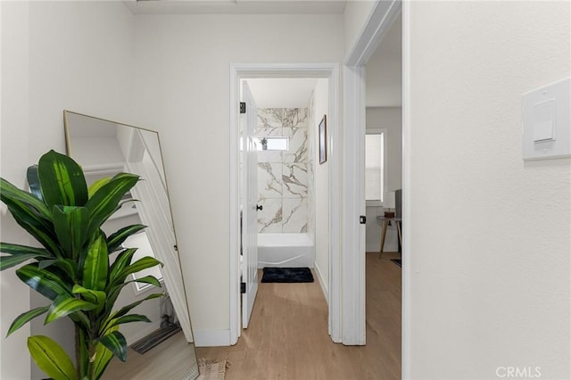 2998 N H St, San Bernardino, CA 92405 - hallway with light wood-type flooring and baseboards