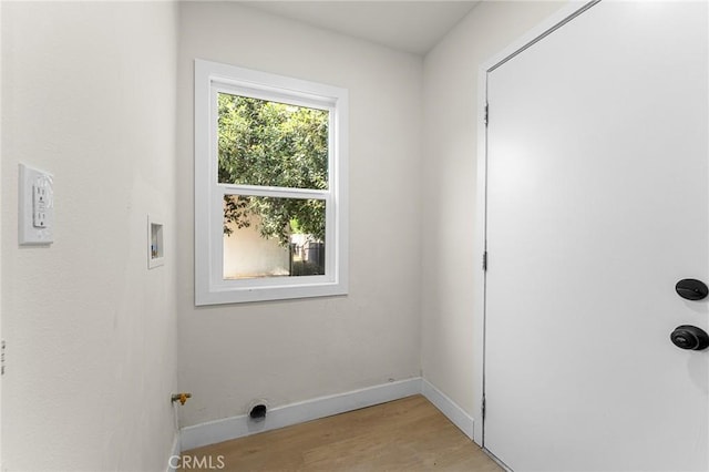 2998 N H St, San Bernardino, CA 92405 - laundry room featuring washer hookup and light wood-type flooring