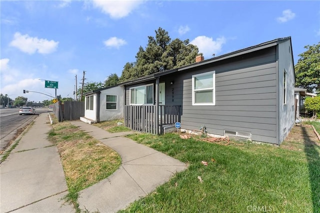 2998 N H St, San Bernardino, CA 92405 - view of front of home with a front yard, crawl space, and a chimney