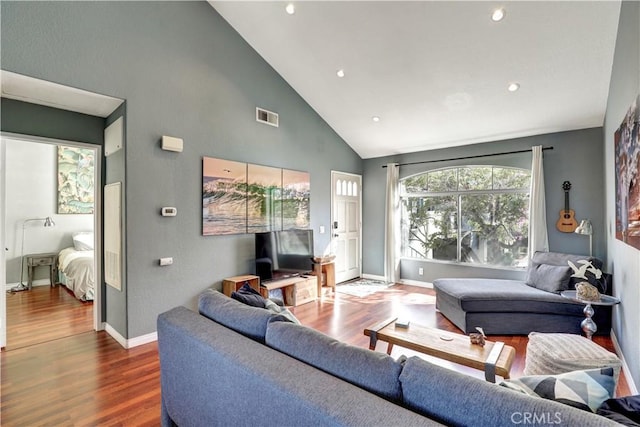 94 Cinnamon Teal, Aliso Viejo, CA 92656 - living room featuring wood finished floors, high vaulted ceiling, and recessed lighting