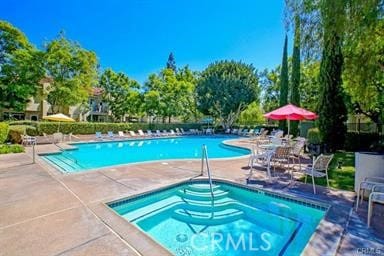 94 Cinnamon Teal, Aliso Viejo, CA 92656 - community pool featuring a patio area and a hot tub