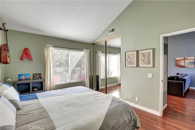 94 Cinnamon Teal, Aliso Viejo, CA 92656 - bedroom with wood finished floors, lofted ceiling, a textured wall, and a closet