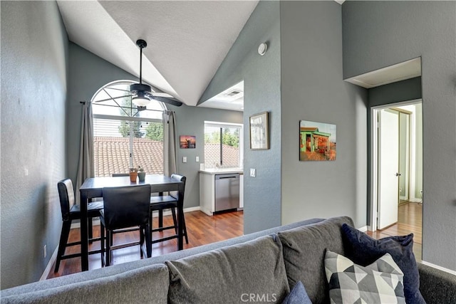 94 Cinnamon Teal, Aliso Viejo, CA 92656 - living area with ceiling fan, wood finished floors, vaulted ceiling, and a textured wall