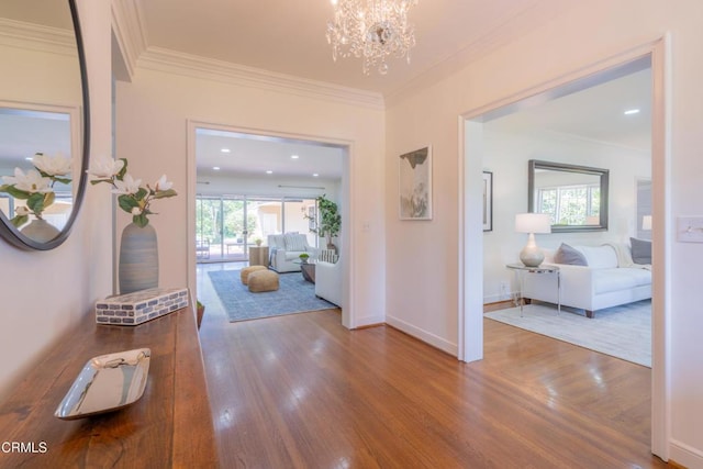 653 Chaucer Rd, San Marino, CA 91108 - hall featuring ornamental molding, wood finished floors, plenty of natural light, and a chandelier