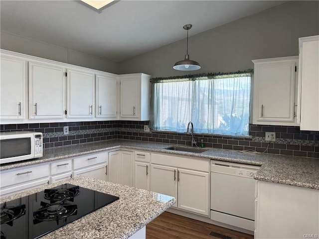 2033 Hollister Rd, Pinon Hills, CA 92372 - kitchen featuring white appliances, white cabinets, dark wood finished floors, and backsplash